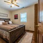 cropped bedroom with window and ceiling fan